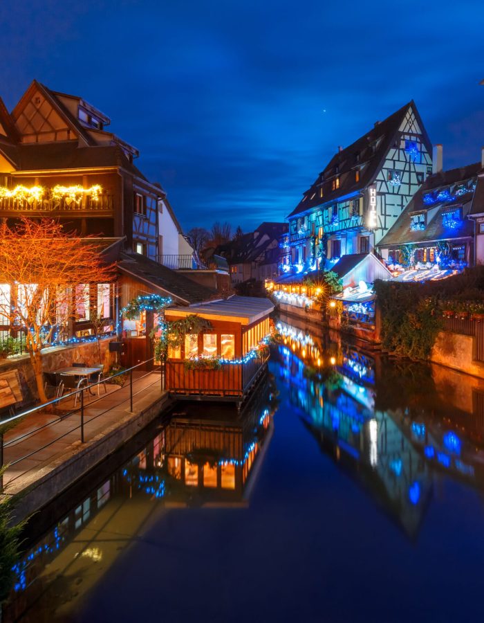 traditional-alsatian-half-timbered-houses-and-river-lauch-in-petite-venise-or-little-venice-old-town-of-colmar-decorated-and-illuminated-at-christmas-time-alsace-france